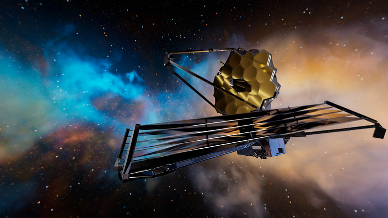 The James Webb Space Telescope explores deep space, passing a colorful nebula in the background.