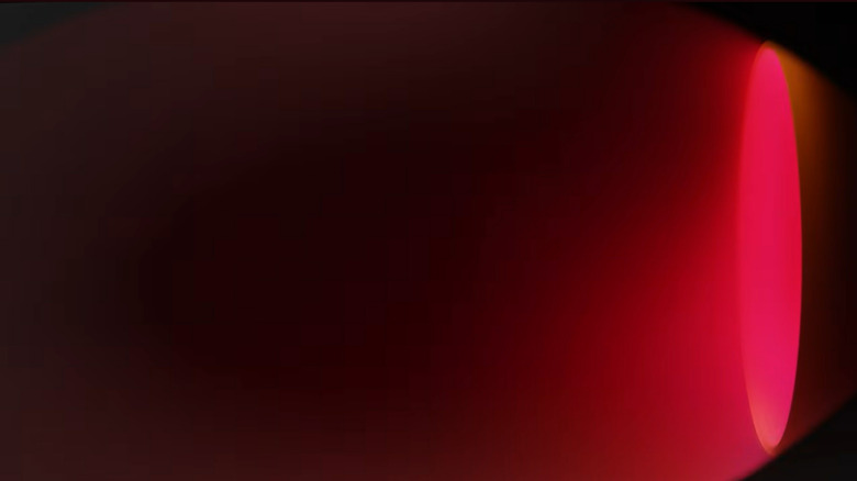 A test of nuclear propulsion rockets shows a bright red light emanating from a thruster