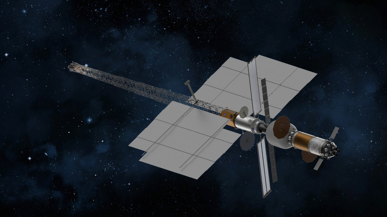 An artists' drawing shows an arrow-shaped grey nuclear-powered space station rocketing through space