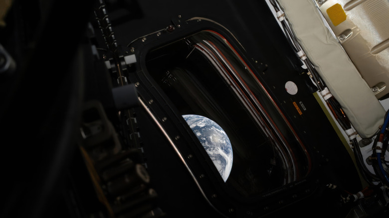 A view of Earth taken by NASA astronaut and Artemis II commander Reid Wiseman from one of the Orion spacecraft's four main window