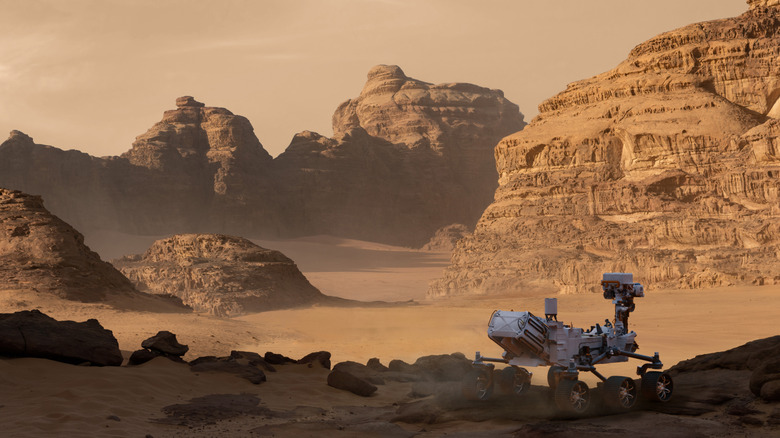 The NASA Perseverance Rover moving across a Martian landscape.