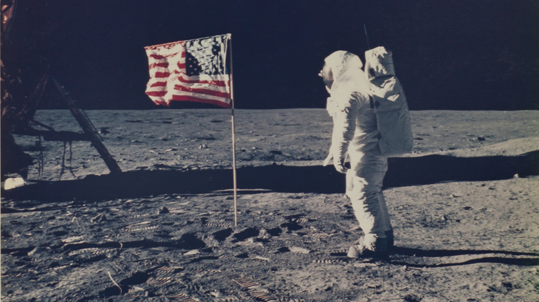 Astronaut Aldrin next to the United States flag on the Moon during the Apollo Mission