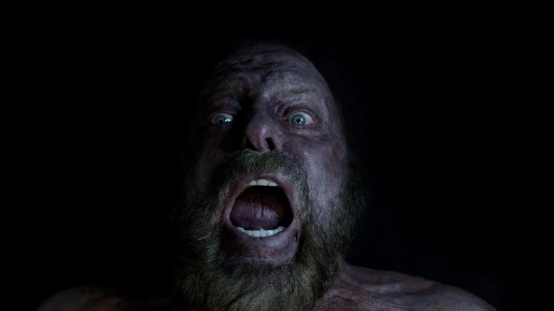 Tom (Neville Archambault) screaming in 