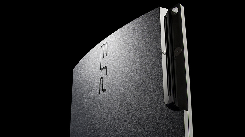 PS3 slim console on black background