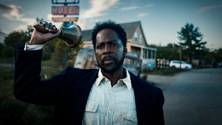 Harold Perrineau in From holding a bell