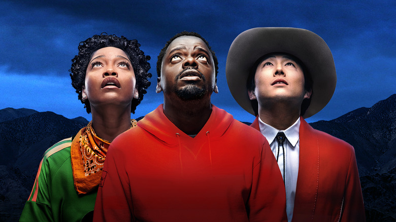 Keke Palmer, Daniel  Daniel Kaluuya, and Steven Yeun looking up in Nope.