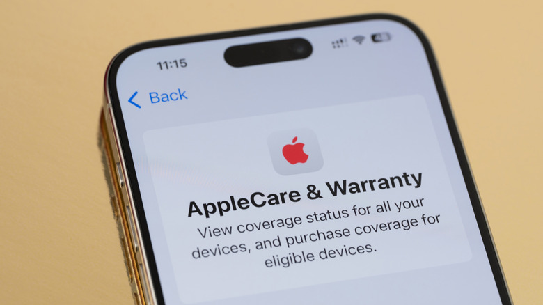 applecare and warranty screen on a iPhone placed on a woonden table