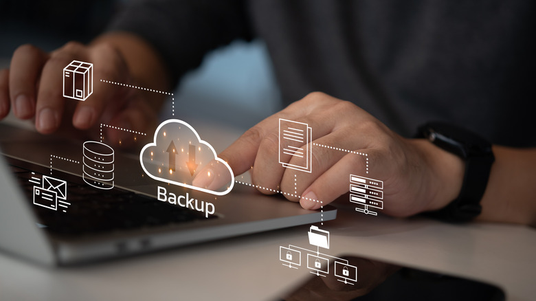 A professional using a computer to backup data