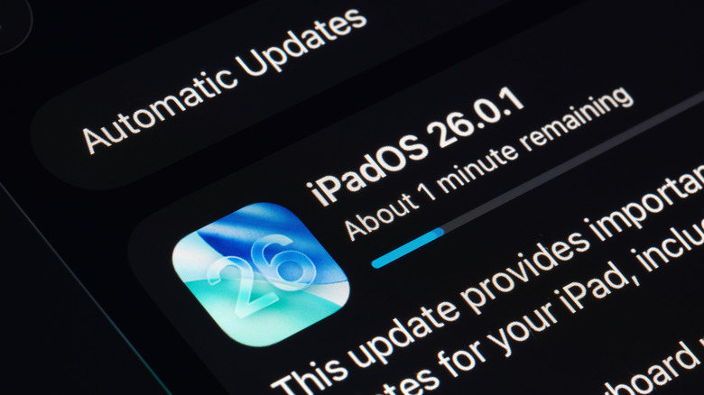 The iPadOS 26.0.1 update downloading on an iPad screen.