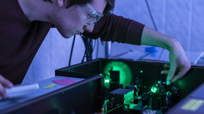 man working with lasers that could help power a futuristic quantum computer