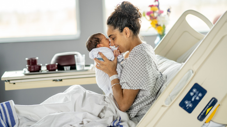 a mother and newborn baby in the hospital