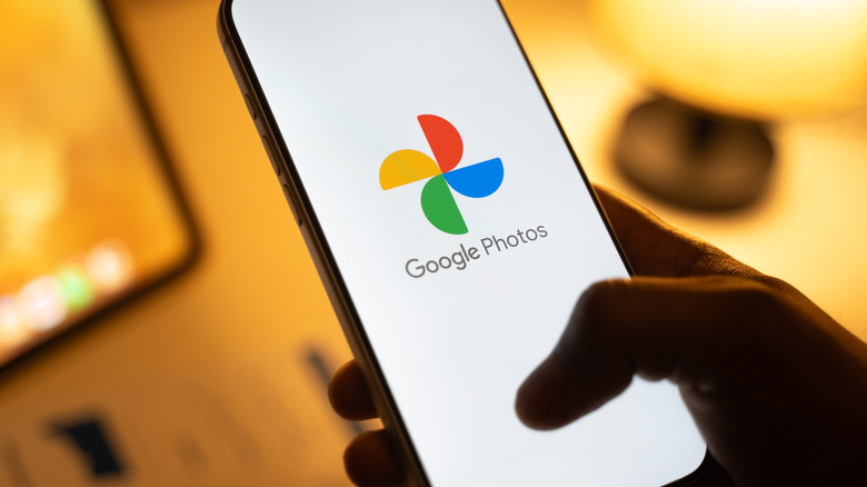 The Google Photos logo on a smartphone display.