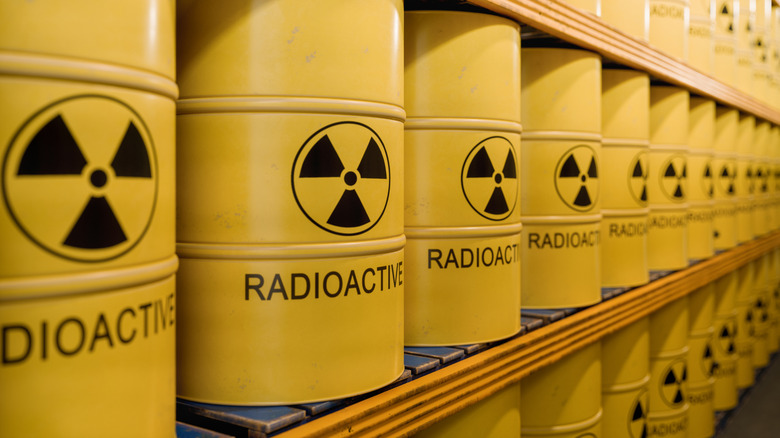 Yellow barrels of radioactive waste lined up on shelves