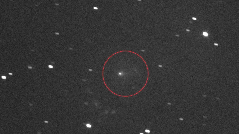 NASA's Lucy spacecraft captures the flight path of 3I/ATLAS, circled in red in the center of this black and white image.