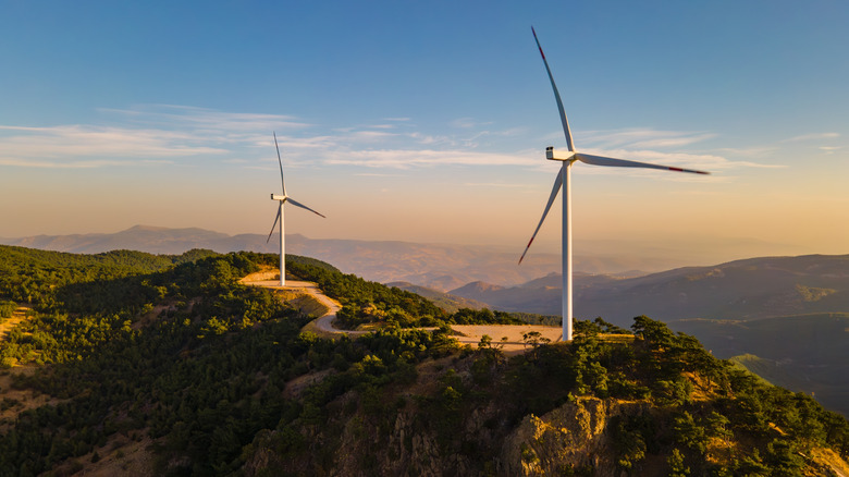 Wind turbines high on a mountain.