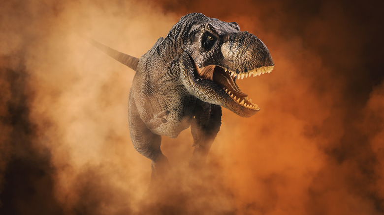 a T. Rex walking through red smoke