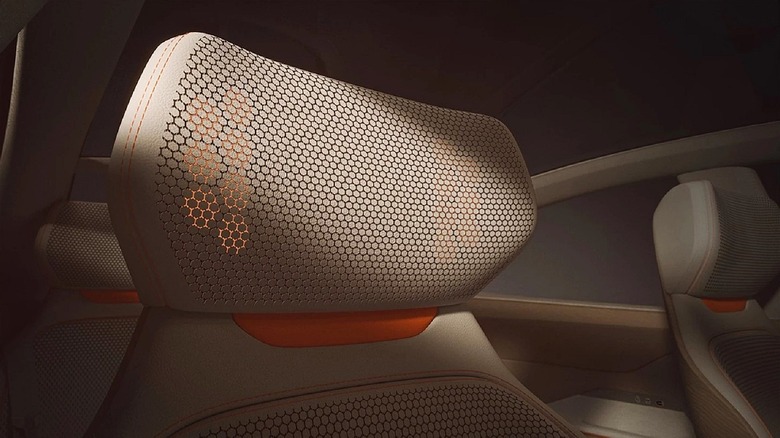 Conceptual image of Warwick Acoustics next-gen speaker, placed inside seat headrest, is shown.