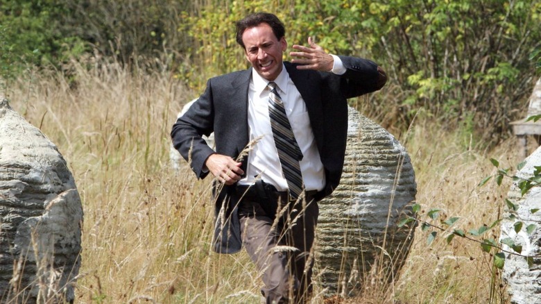 Nicolas Cage running from bees in The Wicker Man