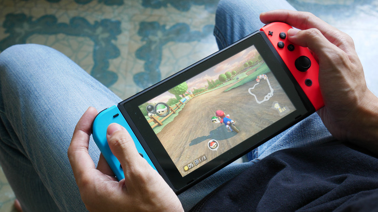 person playing mario kart on nintendo switch