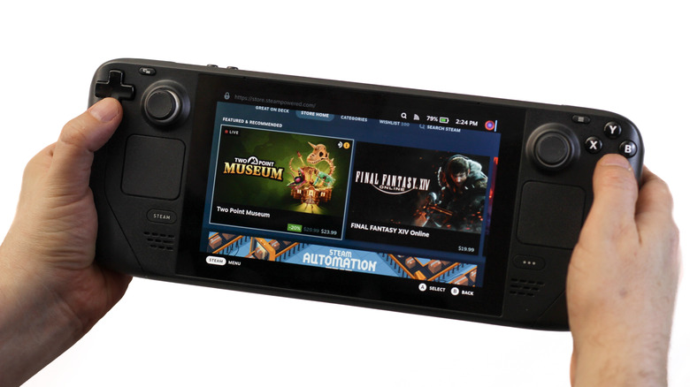 Steam Deck handheld gaming PC showing the Steam store while held in both hands.