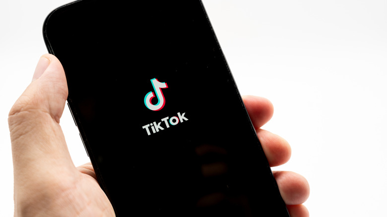 TikTok logo on a smartphone