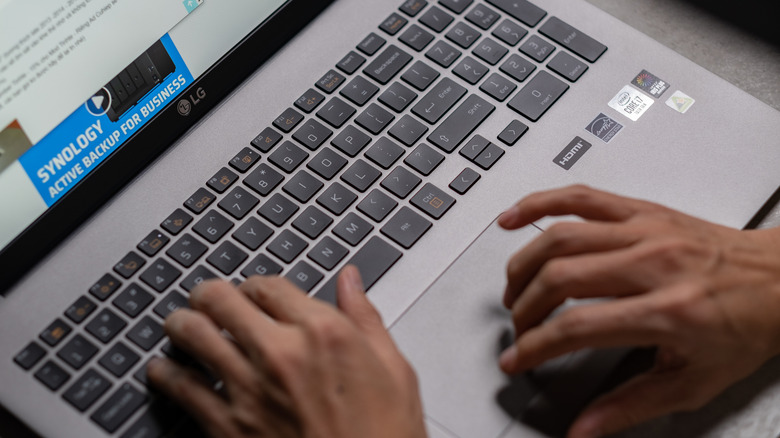 A person using an LG laptop
