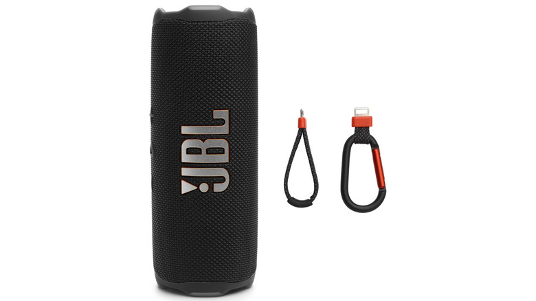 The JBL Flip 7 and its detachable carabiner and strap accessories.