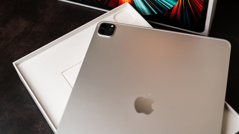 An iPad Pro resting on top of its box.