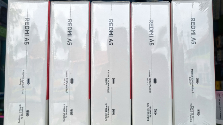 A close up image of multiple Redmi A5 boxes on a table