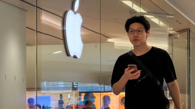 Shenzen Apple store with customer walking past