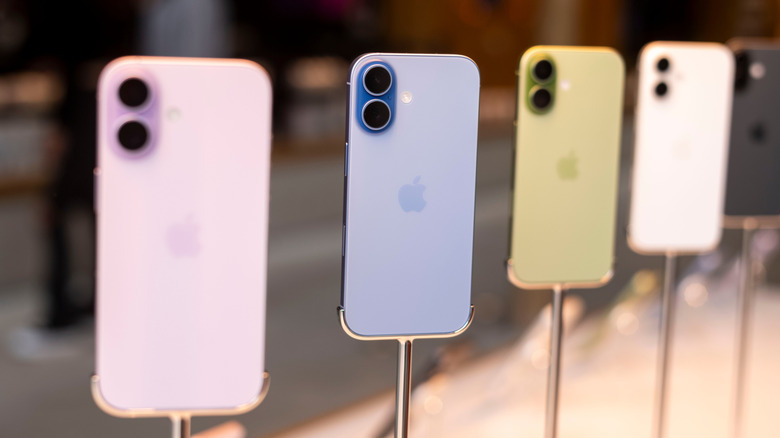 A lineup of colorful Apple iPhones on display