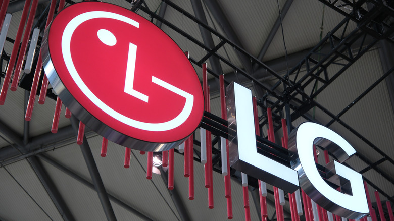 The LG brand logo near a ceiling, mounted to metal rafters