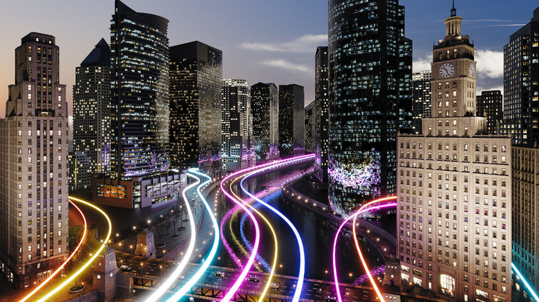 Colorful lines representing speedy broadband signals race through  downtown city skyline.