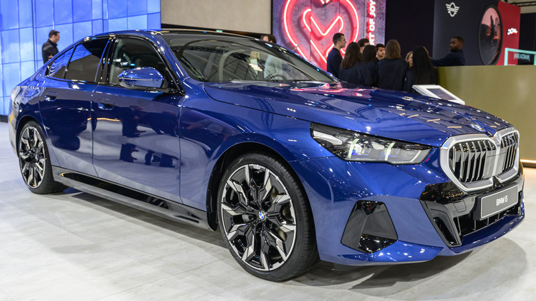 BMW i5 luxury electric EV at a motor show