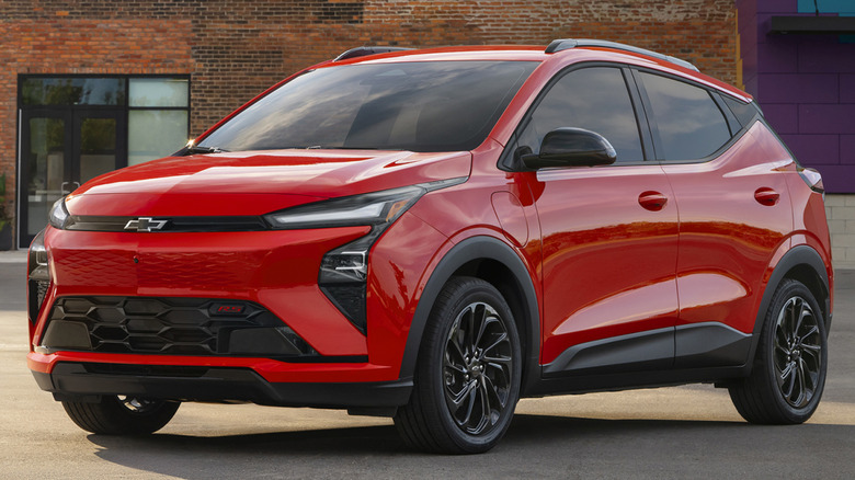 Red 2026 Chevy Bolt front 3/4 parked