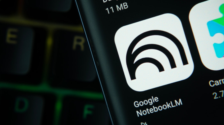 notebooklm app icon on smartphone over a keyboard