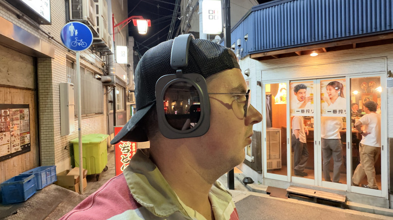 Nothing Headphone (1) Pro on a man's head while walking around