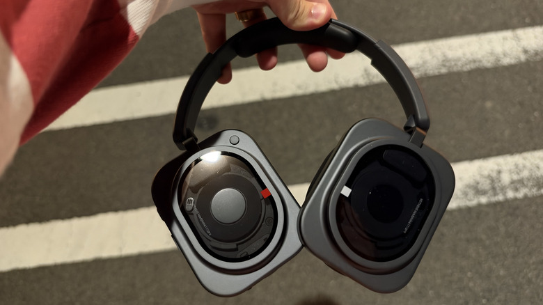 Nothing Headphone (1) Pro being held out in the wild