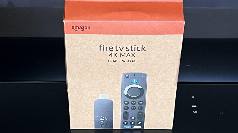 Fire TV Stick 4K Max in its packaging on a soundbar