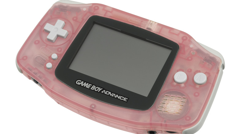 A translucent pink Game Boy Advance with light gray buttons against a white background.