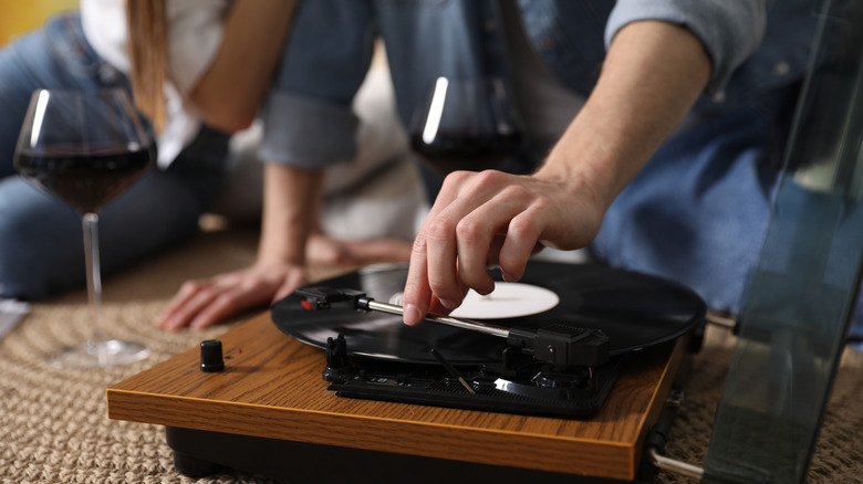 Young people listening to music on vinyl