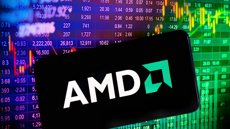A closeup of a the AMD logo as it appears on a smartphone, the background has several numbers within a colorful spreadsheet