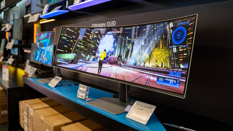 Display of Samsung Odyssey OLED ultrawide gaming monitor in a store