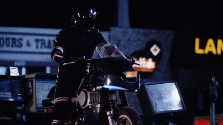 A man sitting on the Street Hawk motorcycle.