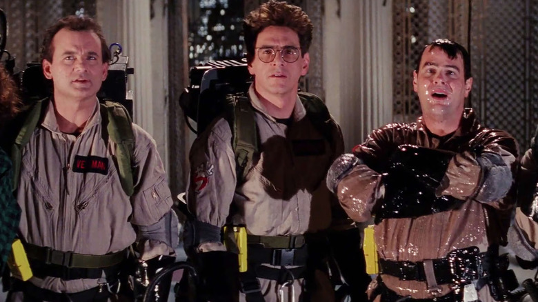 Peter, Harold, and Ray standing next to each other and looking at something