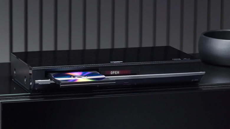 Panasonic's Panasonic DP-UB820 on a TV stand