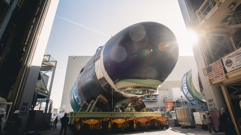 The SSN-798 nuclear submarine being worked on at a shipyard.