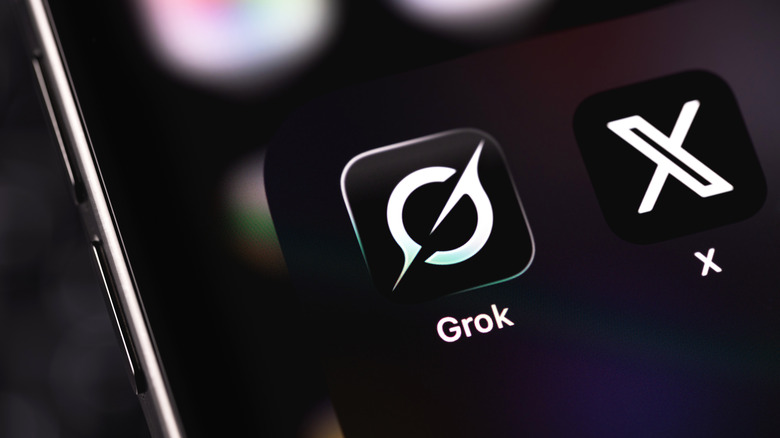 Grok and X mobile icon app on a screen smartphone. Grok is a generative AI-powered chatbot developed by xAI
