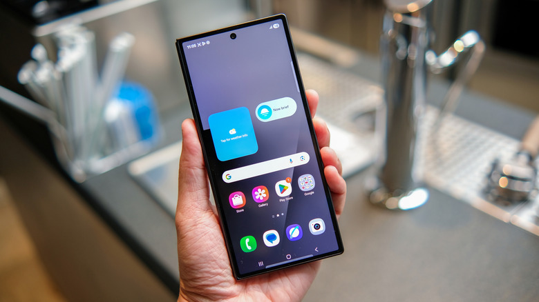 A person holding a Galaxy Z Fold 7 showing Samsung's One UI