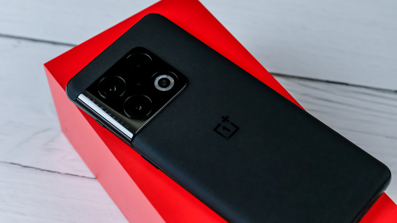 oneplus smartphone on a red box, back up